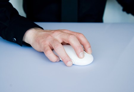 Hand on a wireless mouse