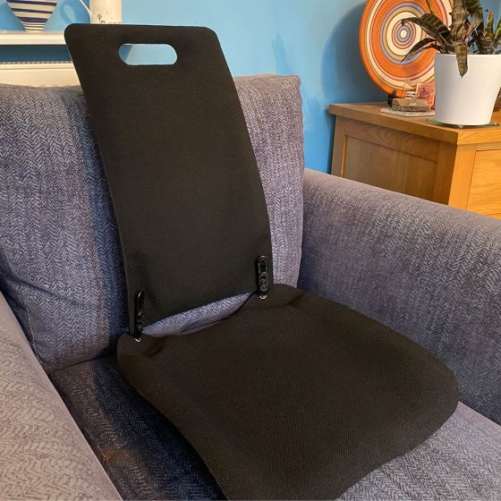 MEDesign Backfriend - Black - lifestyle shot, shown on an armchair