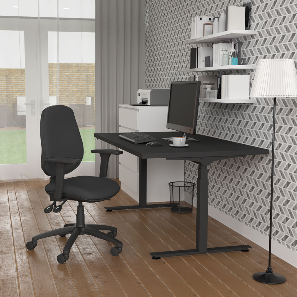 JOSHO Homeworker Electric Sit-Stand Desk - lifestyle shot - black desk and frame, side angle view, showing seated position
