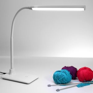 Daylight Company UnoLamp Table - lifestyle shot, showing knitting