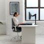 Monto Sit-Stand Riser - lifestyle shot, side view, closed, in sitting position