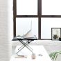 Monto Sit-Stand Riser - lifestyle shot, side view, raised, with desktop accessories