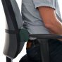 Posturite Lumbar Roll (Circular) - side view, shown on an ergonomic chair