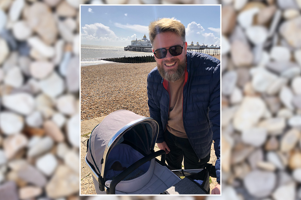 Father taking his baby out to Eastbourne