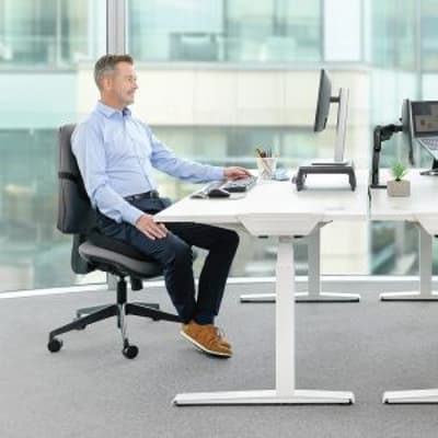 Breyta™ Comfort Seat Cushion - lifestyle shot, showing the cushion in use on an ergonomic office chair, in an office environment