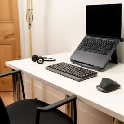 Positiv Homeworker Desk (Foldaway Legs) - lifestyle shot of white desk with silver legs