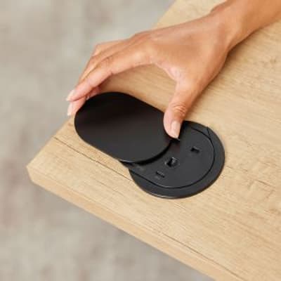 Desk Power Grommet Socket - black, lifestyle shot showing socket in situ