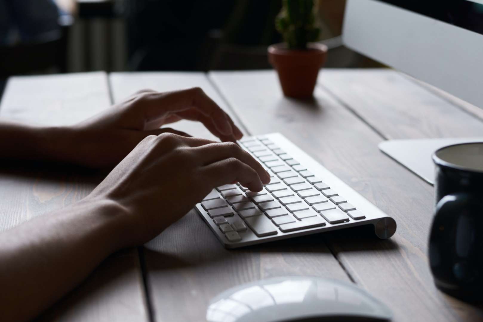 Lifestyle shot, showing a close up of someone using an ergonomic keyboard