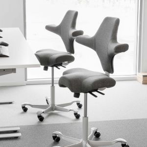 HÅG Capisco 8106 Grey Office Chair - lifestyle shot, shown in an office environment