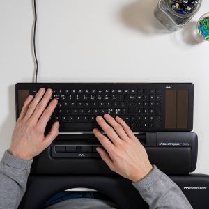 Mousetrapper Delta Regular - black, birdseye view lifestyle shot, with keyboard and arm support 