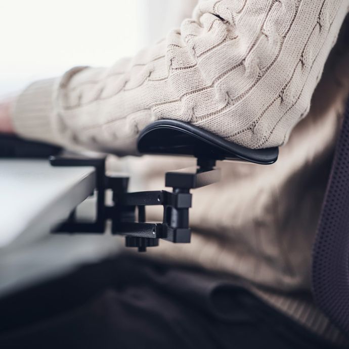 Mousetrapper Armrest Dynamic - lifestyle shot, shown in use while seated