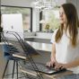 Standfriend Sit-Stand Platform (Black Frame) - back angle view lifestyle shot, showing 'in use, standing' with a laptop and keyboard