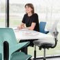HÅG Capisco Puls 8020 Sea Green Office Chair - lifestyle shot, shown in an office environment