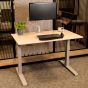 JOSHO Homeworker Beech Electric Sit-Stand Desk - lifestyle shot, shown with a monitor arm, keyboard and mouse