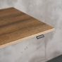 KOJI Italian Oak Electric Sit-Stand Desk - close up of desktop and switch