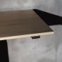 KOJI Natural Oak Electric Sit-Stand Desk - close up of desktop and switch