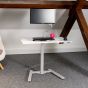 KOJI White Electric Sit-Stand Desk - lifestyle shot, with monitor arm, keyboard and mouse