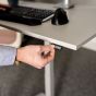 KOJI White Electric Sit-Stand Desk - lifestyle shot, showing close up of switch