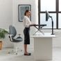 Monto Sit-Stand Riser - lifestyle shot, side view, raised, in standing position