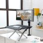 Monto Sit-Stand Riser - lifestyle shot, front angle view, raised, with monitor arm