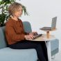 Otto Laptop Table (Oak Top, Grey Base) - lifestyle shot showing the table in use with a laptop, separate keyboard and mouse, providing good ergonomic posture