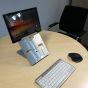 Lifestyle shot of the Vision Tablet Stand, along with a standalone keyboard and mouse, in an office environment