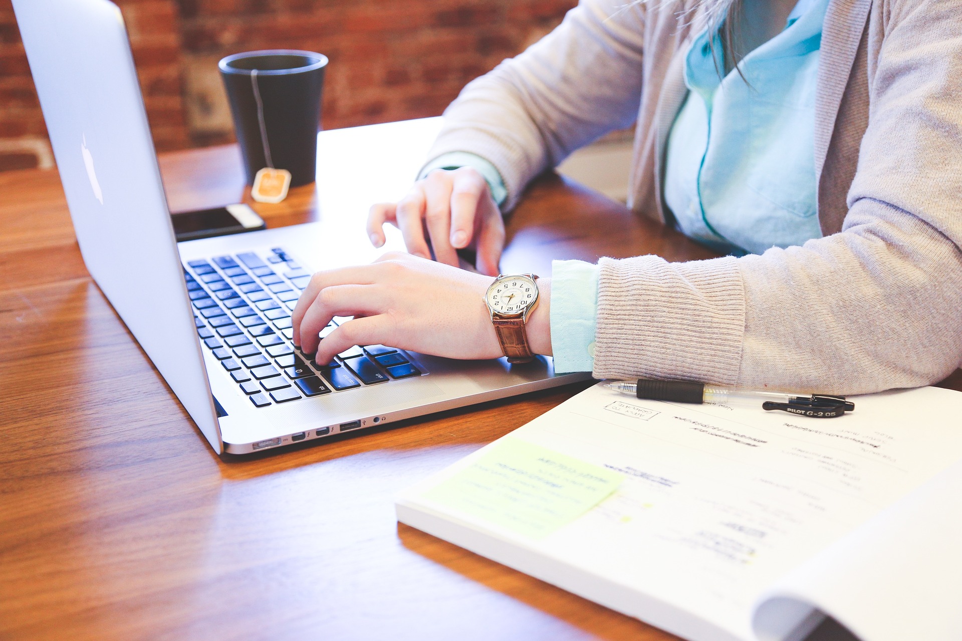 Lifestyle shot showing a student using a laptop