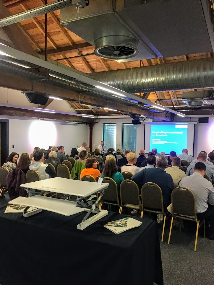 Delegates listening to one of our talks at a recent symposium in Manchester