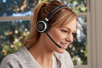 Image of happy woman using the Jabra Evolve 65 Headset - working from home