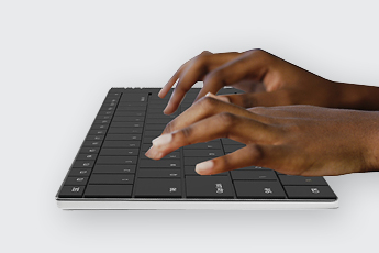 Side view of someone typing on the Solo X Keyboard
