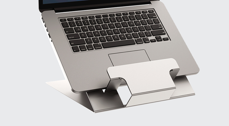 Close up image of the Hylyft Laptop Stand in place with use of laptop