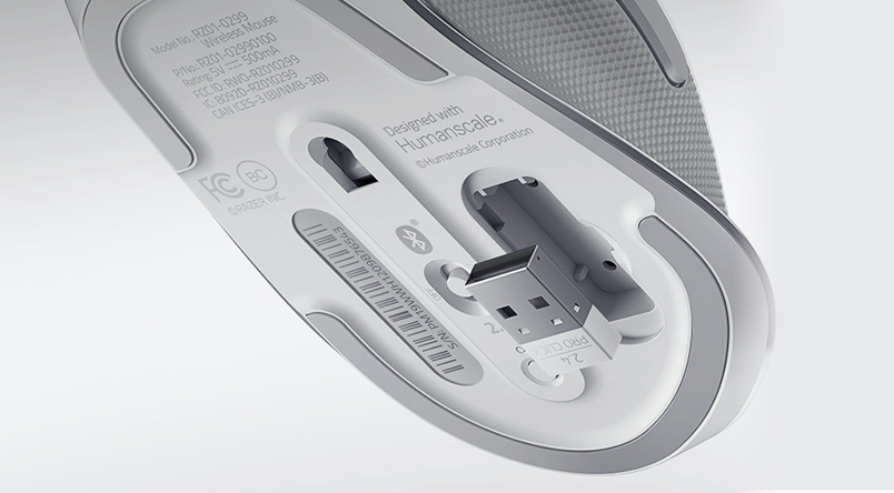 Image showcasing bottom on the underside of the mouse with the USB connector 