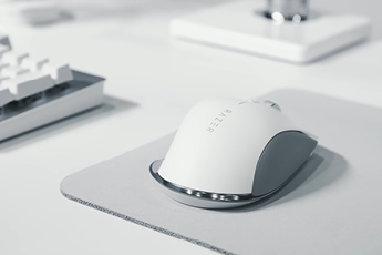 Close up image on Humanscale X Razor Mouse on mouse mat on desk workstation set-up
