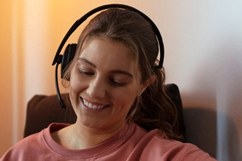 Woman using the EPOS ADAPT 230 Bluetooth Mono Headset