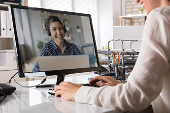 Lifestyle shot showing someone on a video call using a headset