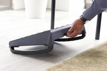 Lifestyle image of the Breyta™ Foot Suport, showing how it can be easily moved for hybrid working