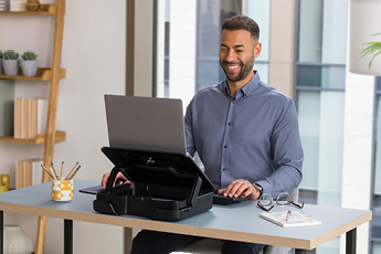Lifestyle image of the Breyta™ Laptop Carry Case, shown set up as a laptop stand