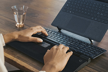 Lifestyle image of the Contour RollerMouse Pro, shown in use with a separate keyboard