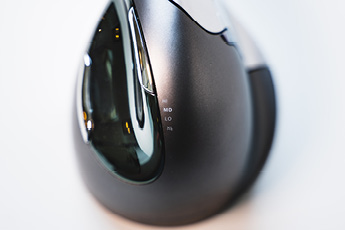 Lifestyle top view of the Evoluent VerticalMouse 4, showing the two thumb buttons