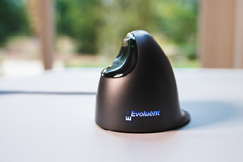 Lifestyle back view of the Evoluent VerticalMouse 4, shown on a desk