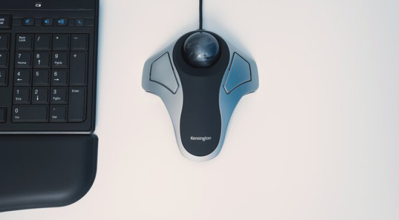 Image showing the Kensington Orbit® Optical Trackball Mouse alongside a keyboard and wrist rest