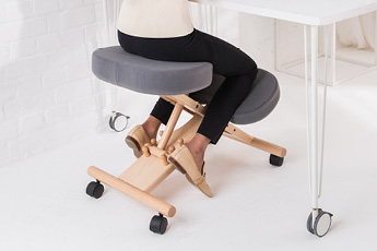 The Putnams Kneeling Chair being use at a desk