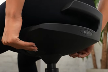 Lifestyle image of the Muvman Standing Chair, showing the easy touch buttons hidden under the seat