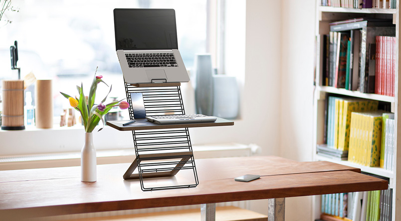 The Standfriend Sit-Stand Platform, shown within a home office environment
