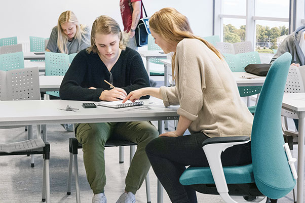 A teacher discussing work with a pupil